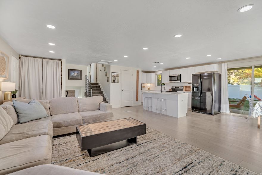 **SELLER OFFERING $5,000 in concessions towards closing costs/rate buy down or window installation in the basement** $3,000 Credit being offered for front yard to have sod laid.  This home was beautifully remodeled in 2022, and a new roof installed in 2024! It's located in an excellent East Orem neighborhood! Separate entrance basement with a mother in law apartment potential. Fully equipped to be used as one. There are 2 non-conforming bedrooms in the basement. Large open concept great room with adjoining family room, dining room and kitchen featuring laminate hardwood flooring throughout. White cabinetry, subway tile backsplash, stainless steel appliances, farmhouse sink, black hardware, and recessed lighting complete the modern look. Stylish bathrooms with custom tile, striking lighting and fixtures, and a neutral color scheme. Fresh exterior paint with carport and RV parking, plus a large backyard with covered patio!  Square footage figures are provided as a courtesy estimate only and were obtained from previous owner's measurement. Buyer is advised to obtain an independent measurement.