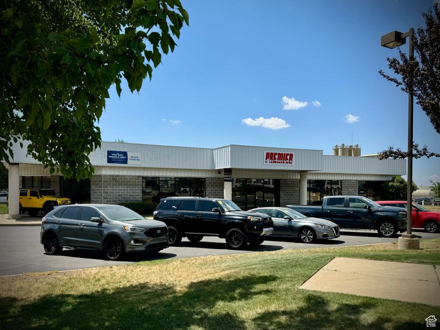 Ideal corner lot in East Davis County with frontage on HWY 193 and Fairfield Drive. The property is currently used as a car lot/office and shop but could easily be transformed into a new retail project. The 9,634 sq. ft. building includes 6,934 sq. ft. of office/showroom space and 2,700 sq. ft. of insulated, heated, and cooled shop space. The shop is easily accessible through three 12' overhead doors. 15' ceiling height in shop areas. The large showroom is wrapped in floor-to-ceiling windows. The lot is partially fenced for additional secured parking. Please do not disturb the current tenant. All showings must be scheduled through the listing broker.