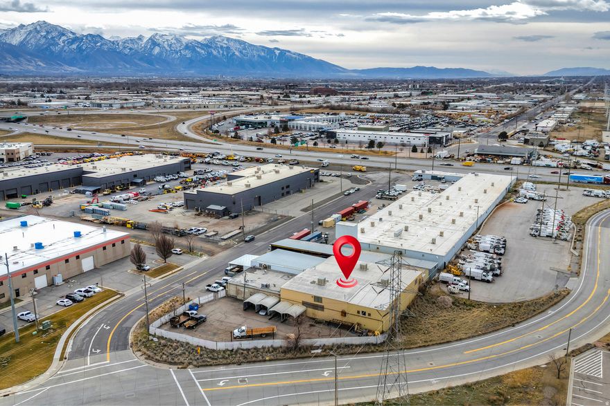 13,303 SF industrial warehouse on 0.85 acres zoned M-1/M-2 in Salt Lake City. Includes 12,428 SF warehouse, 875 SF office, and 12,700 SF secure fenced yard for fleet parking or equipment storage. Equipped with 400-amp, 480V, 3-phase power, five gantry cranes, equipment pit, 8,460 SF covered storage, 7,950 SF covered area, and 510 SF garage. Ideal for owner-users or investors seeking warehouse with yard, trucking terminal, contractor yard, or manufacturing use with excellent access to major transportation routes.
