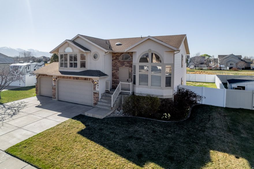 Welcome to this exceptional home in the heart of Hooper.with NO HOA.. See virtual video at https://sites.photoslc.com/4641-W-5675-S. Featuring 6 bedrooms, 3 bathrooms, 1/4 acre lot, fully fenced, this home checks all the boxes with comfort and functionality. The huge grand master suite features a walk-in closet, separate tub/shower, double sinks and enclosed toilet room.  The spacious family room has built in bookshelves,a gas fireplace and sliding glass door to the backyard.  A covered deck overlooks the green space (with backyard access) and slough (complete with fish) with a walking trail that ends at a nearby park. Full automatic sprinkler, 3 car garage and cul-de-sac completes this wonderful home!  There is large storage under the formal living room. Square footage figures are provided as a courtesy estimate only and were obtained from county records. Buyer is advised to obtain an independent measurement.