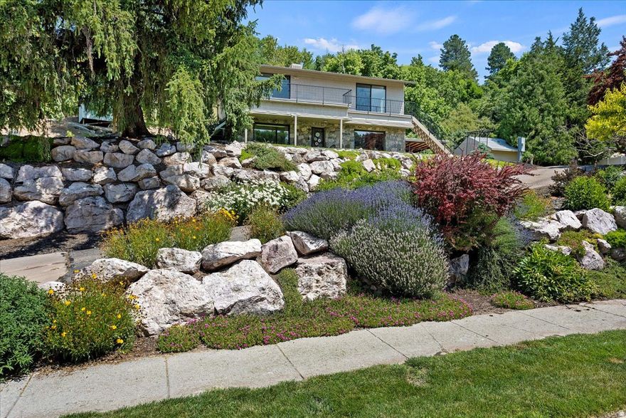 Awesome home in an amazing East Layton location. Updates throughout the home including an updated kitchen, beautiful hardwood flooring, big windows allowing for lots of natural lighting, fireplaces on each level, wood beams and ceiling for a cozy feeling, plenty of storage space, good-sized bedrooms, spiral staircase, newer AC and furnace, and a huge secluded lot. Sale includes Tax ID 09-213-0319. Sq. footage per tax data records. Property facts provided as a courtesy; Buyer to verify all information.