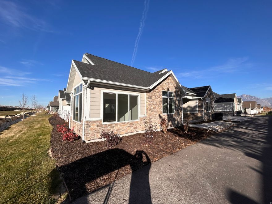 This is a wonderful home in a new 55+ community. It is on a secluded lot with lots of mature trees and landscaping around it. The home features and amazing great room and beautiful sunroom that brings in a lot of light.