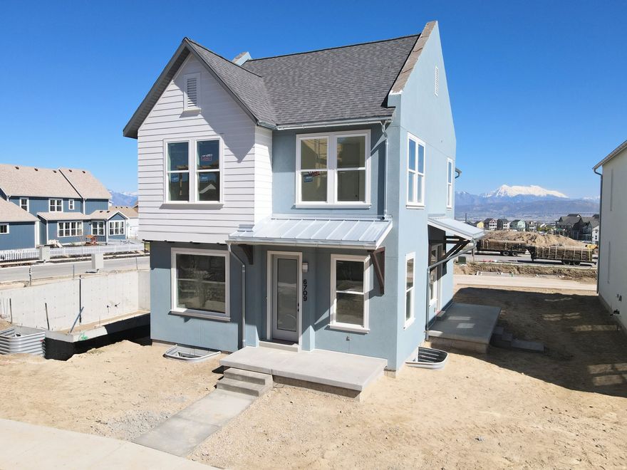 Brand new home under construction featuring a finished basement, full side and backyard landscaping, and designer interior upgrades throughout! This home offers 9-foot ceilings on every level, a grand primary suite, and a versatile loft on the second floor. Stylish details include metal railings and upgraded kitchen cabinetry extending to the ceiling. The thoughtfully designed floor plan features a spacious living room with a cozy fireplace, seamlessly open to the dining area and kitchen with a large island, perfect for entertaining. A generous walk-in pantry and conveniently located powder room are tucked just off the two-car garage. Photos are of actual home, Estimated May 2026 Completion.