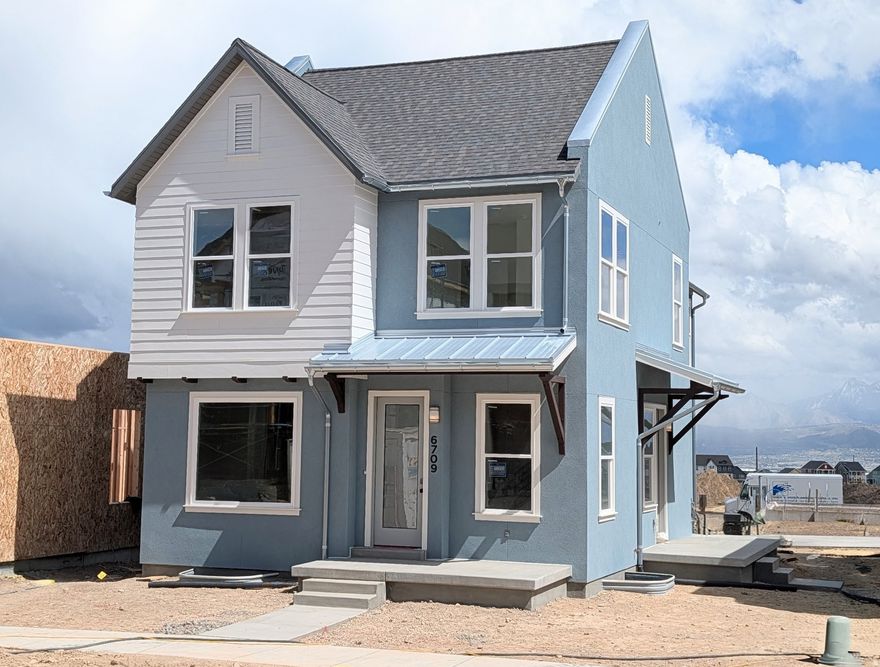 Brand new home under construction featuring a finished basement, full side and backyard landscaping, and designer interior upgrades throughout! This home offers 9-foot ceilings on every level, a grand primary suite, and a versatile loft on the second floor. Stylish details include metal railings and upgraded kitchen cabinetry extending to the ceiling. The thoughtfully designed floor plan features a spacious living room with a cozy fireplace, seamlessly open to the dining area and kitchen with a large island, perfect for entertaining. A generous walk-in pantry and conveniently located powder room are tucked just off the two-car garage. Photos are of actual home, Estimated May 2026 Completion.