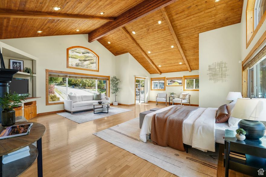 Nestled in the coveted Top-of-the-World neighborhood of Cottonwood Heights, this stunning home captures panoramic views of both the mountains and the city. With quick access to nearby trailheads and Little Cottonwood Canyon, it's perfectly positioned to enjoy mountain living. Completely renovated down to the studs in 2011, this 6-bedroom, 6-bath residence with an office combines thoughtful design and comfort throughout. The spacious kitchen-complete with a wine fridge-flows seamlessly into the sunroom, creating the perfect space for entertaining while soaking in breathtaking city views. Outside, the patio features a rotisserie fireplace, a gas fireplace beneath the gazebo, and the peaceful sound of a waterfall for a truly relaxing outdoor retreat. Upstairs, every bedroom has balcony access. The two north-facing rooms feature custom turrets with 270-degree views of the mountains and city, complemented by built-in desks ideal for reading or study. A third bedroom with an en suite bath offers an inviting space for guests. Through the study lies the primary suite, set on its own level for ultimate privacy. With hardwood floors, vaulted wood ceilings, and massive east- and west-facing windows, it feels like a private sanctuary in the sky. Enjoy the sunrise from the "coffee deck" and the sunset from the "wine deck", both offering incredible views. A double-sided fireplace adds warmth to both the bedroom and the en suite bath, which includes a jetted tub, dual vanities, dual walk-in closets, and a large shower with two showerheads. The walkout basement includes two bedrooms with sliding glass doors, a fully equipped kitchen, a full bathroom, and a wine room. Practical upgrades include three HVAC units for zoned comfort, newer windows, paid-off solar panels, updated plumbing and electrical, a commercial-grade tankless water heater, and even a half bath with a urinal in the garage. The 3-car garage is extra deep, extra wide, and includes two extra-tall bays for larger vehicles. The exterior landscaping features a xeriscaped front entry and eight fruit trees-peach, pear, apple, plum, and cherry varieties. Every detail of this Cottonwood Heights retreat has been crafted for those who value space, comfort, and the beauty of Utah's natural surroundings-all just minutes from world-class recreation and city conveniences.