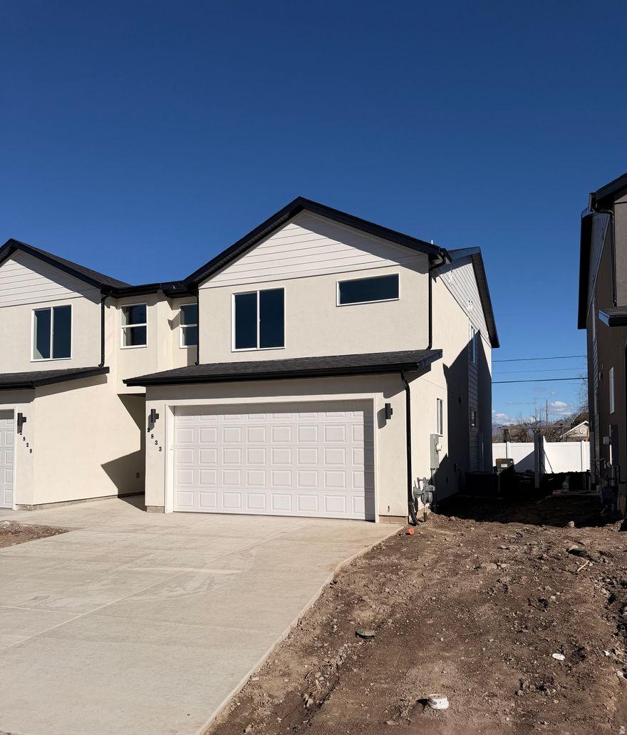 PRICE IMPROVEMENT and now MOVE-IN READY! Enjoy the benefits of a brand new twin home without the hassle of an HOA or large community. Built by Next Level Homes, these quality residences feature an open floor plan, stylish finishes, and sit on spacious lots with large yards. High quality finishes including quartz countertops throughout, 42" upper cabinets and high efficiency furnace, plus much more. Convenient Magna location close to schools, parks, and commuter routes. Call agent for more details and access. Buyer to verify all info.