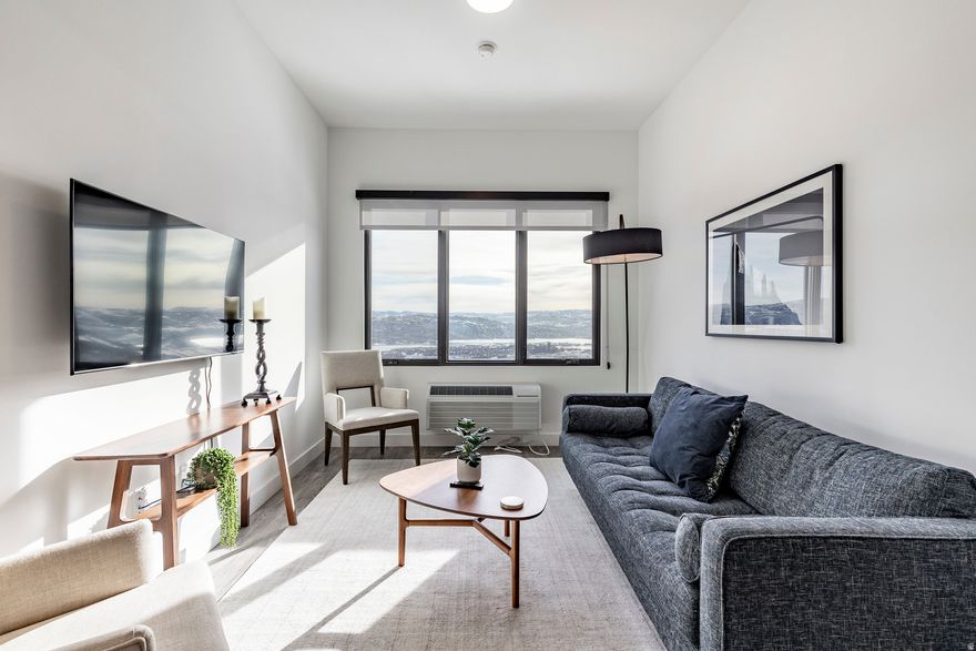 This bright and spacious 1-bedroom unit is ideally located on the top floor of the Baton building at Pioche Village, situated near the heart of the Deer Valley's East Village.  Ski into Pioche Village and soak in the community's amenities that include hot tubs, oversized gym, ski lockers, bike storage, and lounge areas. Ski out via Deer Valley shuttle that stops steps from the Pioche Village, taking you directly to the Jordanelle Gondola. Designed with an open-concept floor plan, this unit maximizes space and functionality, offering plenty of room for both a cozy living and dining area. Families will love the kids' playroom and game rooms, while pet owners will appreciate the convenient dog wash station. With both long-term and short-term rental options available and an on-site property manager for seamless service, this condo offers the perfect blend of comfort, convenience, and investment potential. The purchase of this residence requires a purchase of a deeded parking spot in the Baton building garage, it will be conveyed on a separate bill of sale for $30,000.