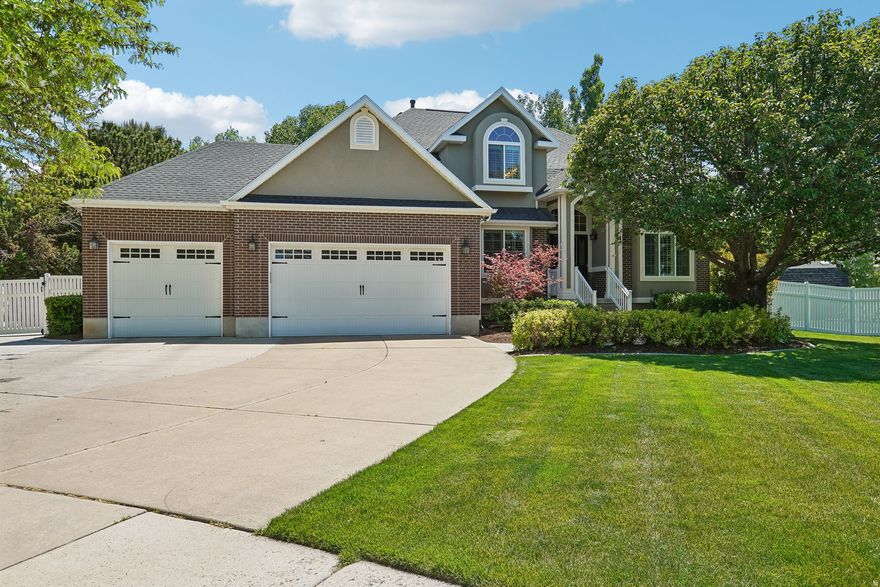 Rare half-acre cul-de-sac opportunity in Kerrybrook Estates. Meticulously maintained 5-bedroom home with mature trees and mountain views. Standout curb appeal is enhanced by permanent Gemstone (jellyfish) outdoor lighting and new stucco, along with a backyard that truly sets it apart. An oversized covered patio opens to a new Trex deck with built-in hot tub, creating a private, usable outdoor retreat surrounded by established landscaping and shade. Inside, three separate living spaces, beautiful custom built-ins, and a kitchen that opens to the main gathering areas deliver exceptional flexibility. Primary suite and upstairs baths were remodeled in 2022. Fully finished basement offers ideal space for media, fitness, guests, or play. 3-car garage plus RV parking. Conveniently located in Kaysville near Barnes Park, local trails, Davis Park Golf Course, and Station Park. Must see!