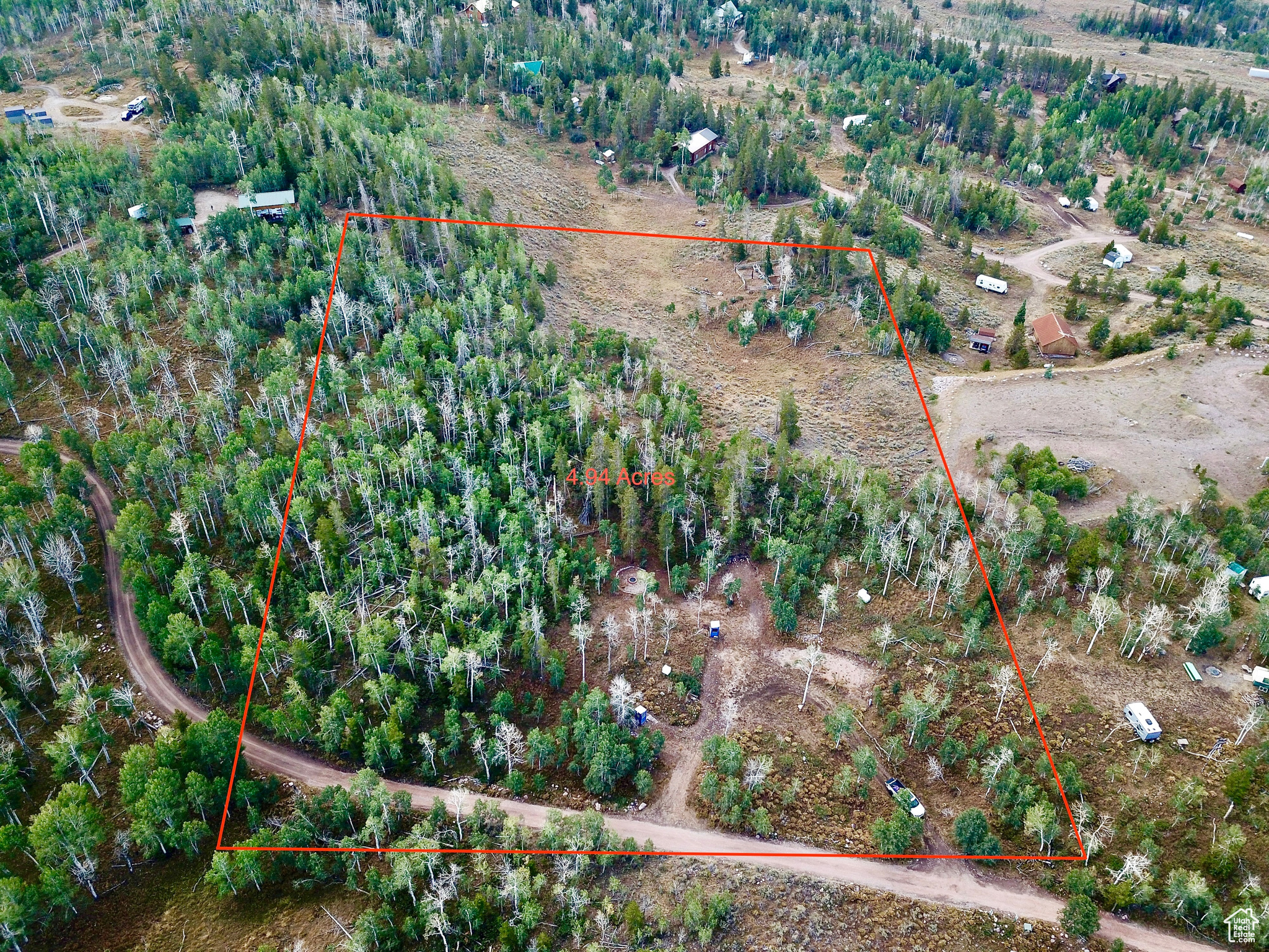 Discover the perfect blend of nature and convenience with this stunning property in the Manor Lands development. Offering a unique mix of flat usable acreage alongside beautiful hilly terrain, this land features gorgeous quaking aspens and majestic pine trees, creating a picturesque setting for your dream getaway. Ideally located just inside the entrance of Manor Land, you'll enjoy quick access to the main paved road, Mirror Lake Highway, while still reveling in the tranquility and privacy this property provides. The site comes equipped with power already run to three designated trailer sites, making it easy to set up your RV or begin building your dream cabin. Imagine evenings by the campfire in your dedicated seating area, surrounded by breathtaking views and the sounds of nature. The property also includes three separate power hookups for RVs and a covered, enclosed outhouse already on site. Plus, youll still have reliable cell phone coverage to stay connected. Don't miss out on this incredible opportunity to own a piece of serene paradise with all the amenities you need to make it your own!