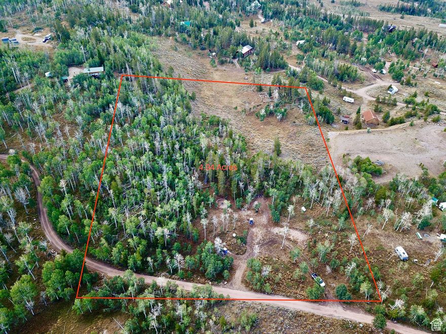 Discover the perfect blend of nature and convenience with this stunning property in the Manor Lands development. Offering a unique mix of flat usable acreage alongside beautiful hilly terrain, this land features gorgeous quaking aspens and majestic pine trees, creating a picturesque setting for your dream getaway. Ideally located just inside the entrance of Manor Land, you'll enjoy quick access to the main paved road, Mirror Lake Highway, while still reveling in the tranquility and privacy this property provides. The site comes equipped with power already run to three designated trailer sites, making it easy to set up your RV or begin building your dream cabin. Imagine evenings by the campfire in your dedicated seating area, surrounded by breathtaking views and the sounds of nature. The property also includes three separate power hookups for RVs and a covered, enclosed outhouse already on site. Plus, youll still have reliable cell phone coverage to stay connected. Don't miss out on this incredible opportunity to own a piece of serene paradise with all the amenities you need to make it your own!