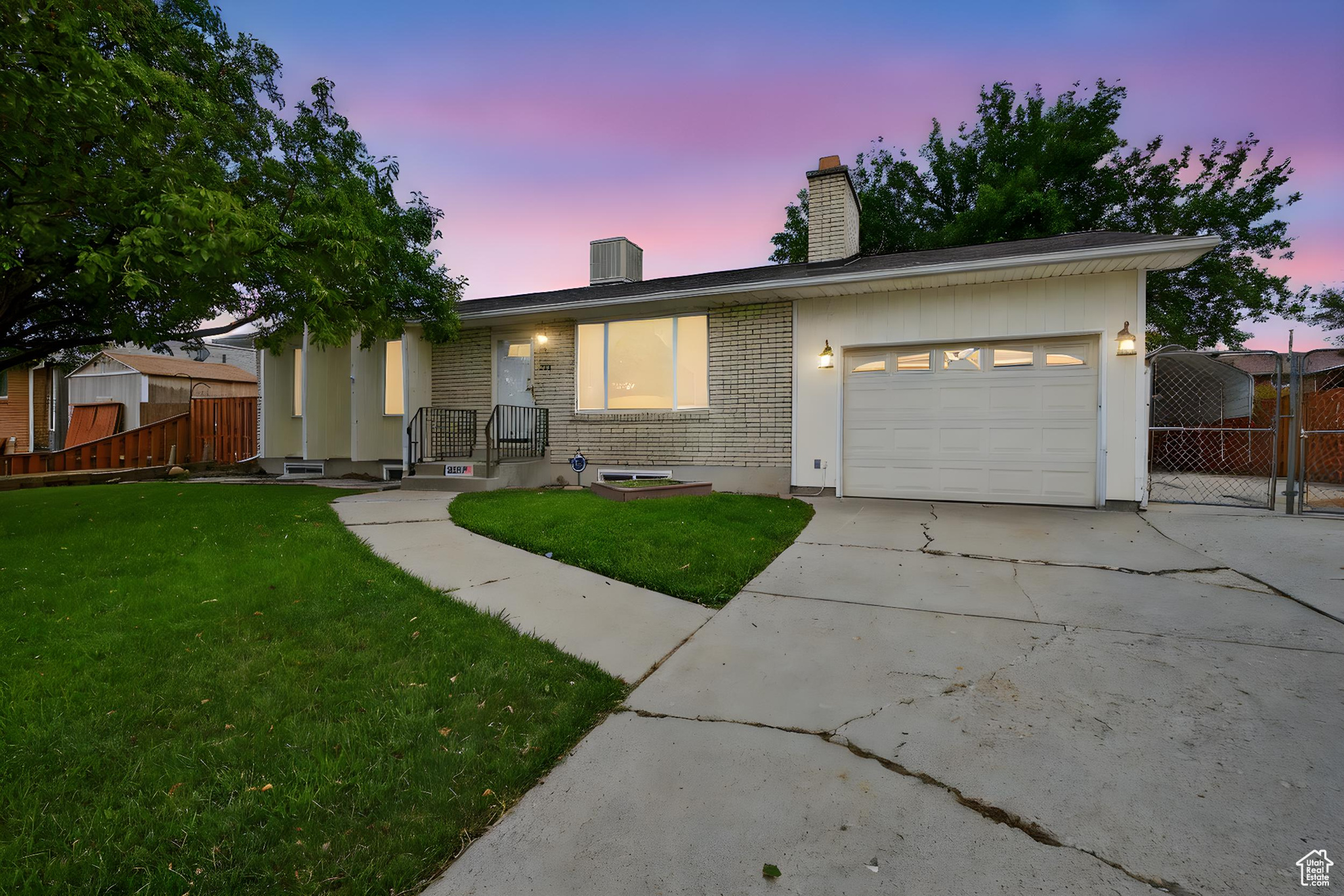 One Owner Gem with Endless Possibilities! Lovingly maintained by its original owner, this exceptional home offers comfort, versatility, and room to grow. Nestled in a quiet neighborhood and ready for your personal touches. Step inside to discover two spacious master bedrooms, dual fireplaces, and an inviting floor plan that allows for both everyday living and entertaining. A downstairs living room offers flexibility and can be easily converted into additional bedrooms, a private mother in law suite, or even an ADU, with convenient access from the attached garage. The basement utility room has additional laundry hookups for easy access! Enjoy outdoor living on the expansive patio and HUGE deck, perfect for gatherings or peaceful evenings. The detached two car garage doubles as a workshop and is easily wired for EV charging, while the RV/boat parking adds to the practicality. This is the shop you've been dreaming of! This home comes equipped with modern upgrades for peace of mind: a newer roof (less than 5 years old), seamless rain gutters, solar panels (to be paid off at closing), and a fully fenced back yard. Plenty of food storage ensures you're always prepared, while the layout offers bonus spaces that could be transformed into a man cave, she den, or hobby retreat. Square footage estimates are provided as a courtesy. Buyer encourage to perform independent measurement.