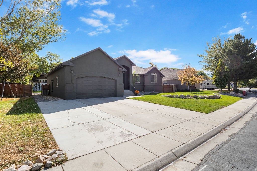 Photo of 495 COUNTRY CLUB DR, Stansbury Park, UT 84074 (MLS # 2185973)