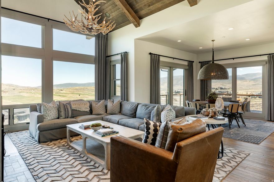 This stunning 4-bedroom, 3.5-bath Cottonwood floor plan at Victory Ranch spans 3,226 sq ft and captures breathtaking views of Deer Valley, the Uinta Mountains, and the Rees Jonesdesigned golf course. Thoughtfully designed by Barclay Butera, the interior showcases Duchateau flooring, rich barnwood accents, a wood-burning fireplace, beautiful furniture, designer wallpaper and custom lighting and draperies in each room. The main level features an open floor plan with great room, vaulted ceilings, gourmet kitchen with Wolf and Sub-Zero appliances, coffee bar, wine fridge, dining room, laundry room, mud room, powder room and a King en-suite with private balcony. On the lower level you will find 3 bedrooms, including a spacious bunk room, 2 bathrooms, and a separate living room. Venture outside and dine on the newly stained deck or gather around the fire pit while soaking in the scenic views and peaceful evenings at the ranch. A perfect blend of rustic warmth and modern elegance, schedule your showing today and make this beautiful furnished cabin home yours! Victory Ranch is a private, four-season community amidst 6,250 pristine acres along four miles of the Upper Provo River. Amenities include an 18-hole Rees Jones-designed golf course, world-class fly fishing, upland bird hunting, 30+ miles of mountain biking and hiking trails, 5-stand shooting facility, archery range, 4x4 adventures, snowmobiles, kids zip-line, backcountry yurts, fishing ponds, multiple restaurants, shuttles to Deer Valley & Park City, a ski-in/ski-out lodge in Park City, and more than 3,500 acres of untouched backcountry. The Post Clubhouse includes our concierge team, heated pool, hot tubs, lounge, and coffee/ice cream bar. The Barn features a fitness center, spa, general store, pizza and ice cream parlor, art studio, game room, indoor basketball/sport court, tennis, paddle, and pickle courts, ice rink, swimming pool with food and beverage service, waterslide, and event lawn for endless family fun. Victory Ranch is less than an hour from Salt Lake airport, approximately 15 minutes from Deer Valley and 25 minutes from Park City.