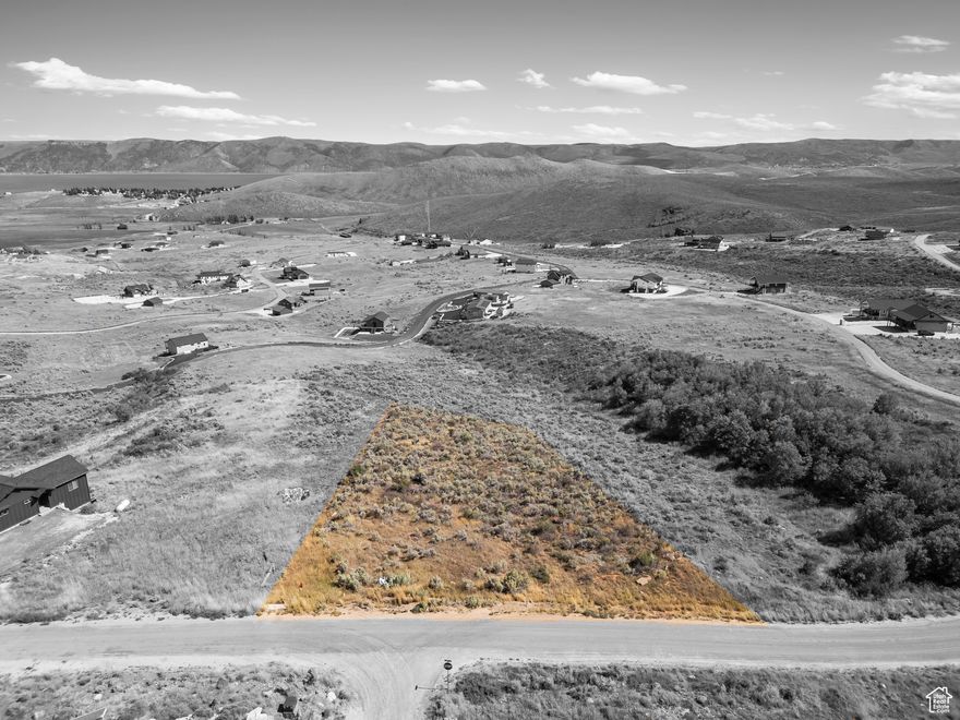 Discover the perfect spot to build your dream getaway or vacation rental investment! This mountainside lot offers sweeping, unobstructed views of Bear Lake, breathtaking sunsets, and the surrounding mountain range. Located in the highly sought-after Sweetwater Subdivision, this property includes access to Ideal Beach amenities-private beach, pools, tennis and basketball courts, and more.  Short-term rentals are approved in the subdivision, making it an excellent income-producing opportunity. The lot features a gentle slope, ideal for a daylight basement design-no costly earthwork required and ready to build.  Just minutes from downtown Garden City, marinas, restaurants, and the famous Raspberry Days Festival. Enjoy year-round recreation with boating, fishing, hiking, snowmobiling, and skiing at nearby Beaver Mountain Resort.  Don't miss this rare opportunity to own a piece of paradise in one of Bear Lake's most desirable areas!