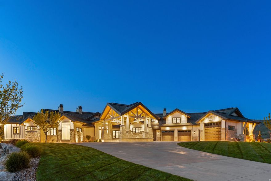 Where mountain mornings meet lakeside afternoons, this private mountain retreat represents one of the highest levels of quality and design in Ogden Valley. Set on over three private acres with a river running along the backyard, the property offers rare seclusion while remaining just minutes from Snowbasin, Powder Mountain, and Pineview Reservoir. Exceptional craftsmanship is evident throughout, including radiant heated floors, en-suite baths, and thoughtfully designed spaces that balance comfort with architectural presence. The main level features a chef's kitchen with Wolf appliances and butler's pantry, expansive gathering areas, a private primary suite, and dedicated office. Designed for hosting at every scale, the lower level includes a secondary kitchen, bar, lounge, golf simulator, and guest accommodations. Outdoor living extends to covered terraces with fireplaces, a lighted pickleball court, and open acreage. A rare opportunity to own a private mountain retreat in one of Northern Utah's most sought after communities. All property information, boundaries and documents to be verified by buyer.