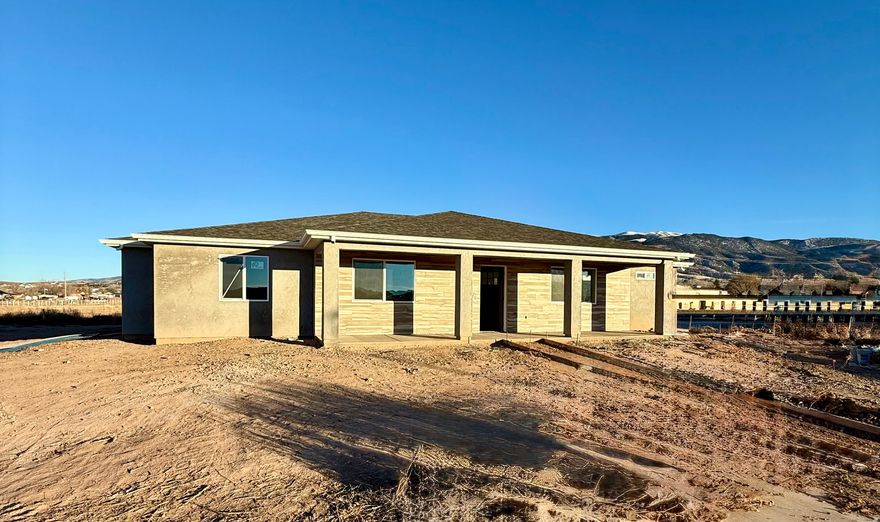 Brand New Single-Level Home with Stunning Mountain Views! Welcome home to this beautifully crafted 4 bedroom, 2 bathroom rambler featuring a spacious 3-car garage and thoughtfully designed no-stairs, single-level living. Located in a quiet, scenic neighborhood, this home offers an ideal blend of comfort, style, and low-maintenance convenience. Step inside to find gorgeous tile flooring, granite countertops, and an open-concept layout perfect for both everyday living and entertaining.The bright, modern kitchen flows seamlessly into the living and dining areas, all framed by incredible mountain views right out your windows.The primary suite offers a peaceful retreat with a walk-in closet and beautifully finished bathroom. Three additional bedrooms provide flexible space for Family to enjoy