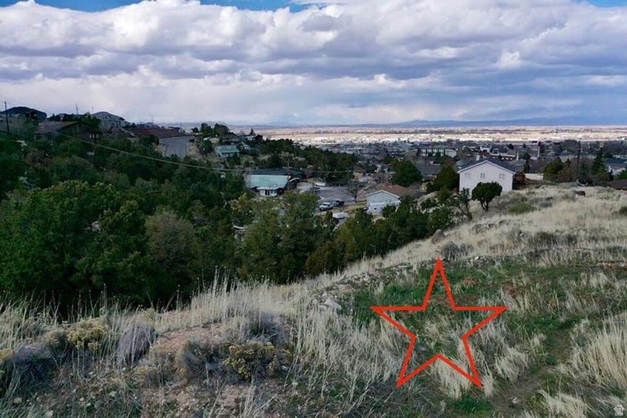 Are you looking for a private setting in Cedar City? This walk out basement lot is just off Ridge Road and ready to be built on. The lot has utilities stubbed in and is ready for someone to build on it. The lot has Pinion and Juniper Trees and is right in the heart of Cedar City on Leigh Hill.