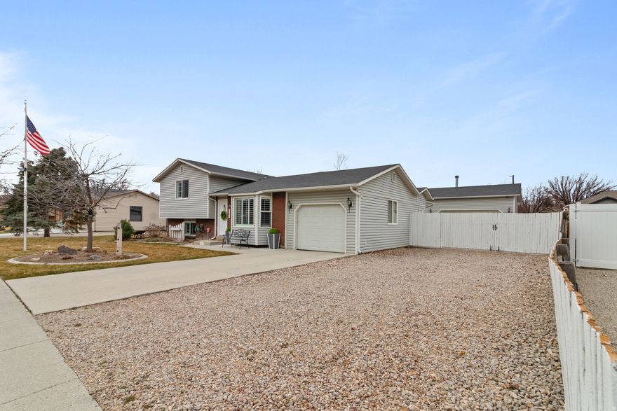 Rare Riverton find with a massive shop and parking for 2 RVs (or 8+ cars)! Located at 12468 S 1510 W, this 1,850 sq. ft. home sits on a secluded 0.25-acre lot in an established neighborhood. The home features 4 bedrooms, 2.5 baths, an updated kitchen, and durable wood and LVP flooring throughout main living areas. The showstopper is the detached 30'4" x 22'4" workshop featuring a 2-car door, wood stove heat, and a private office with A/C. The backyard is an entertainer's dream with a covered patio and a versatile flex structure wired with 220V, audio, and convertible walls-perfect for a hot tub, smokehouse, or outdoor kitchen. Includes two garden sheds and ample crawlspace storage. Prime location just 5 minutes from I-15 and 12600 S retail. Information deemed reliable, but not a guarantee. Square footage provided as a courtesy only. Buyer / Buyer Agent is advised to obtain an independent measurement and to verify all information.