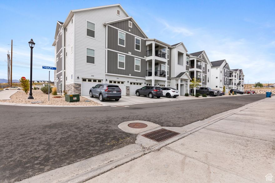 PRICE REDUCTION AND ALL APPLIANCES INCLUDED! Seller offering 1/0 rate buydown with preferred lender 5.271% first-year rate available. Contact agent for details. Seller is also offering **paid HOA transfer fee **3 months of HOA dues! An unbeatable savings package!  This top-floor condo in Saratoga Springs' Wildflower Community offers style, comfort, and convenience. The spacious primary suite includes a walk-in closet, and the open layout provides generous storage throughout. Community perks include a clubhouse and pool, playgrounds, pickleball courts, walking trails, and an upcoming dog park. Plus, a new recreational reservoir for paddleboarding and beach activities is nearly complete. With easy access to Mountain View Corridor, Lehi, I-15, and Salt Lake, this home combines modern living with an unbeatable location.