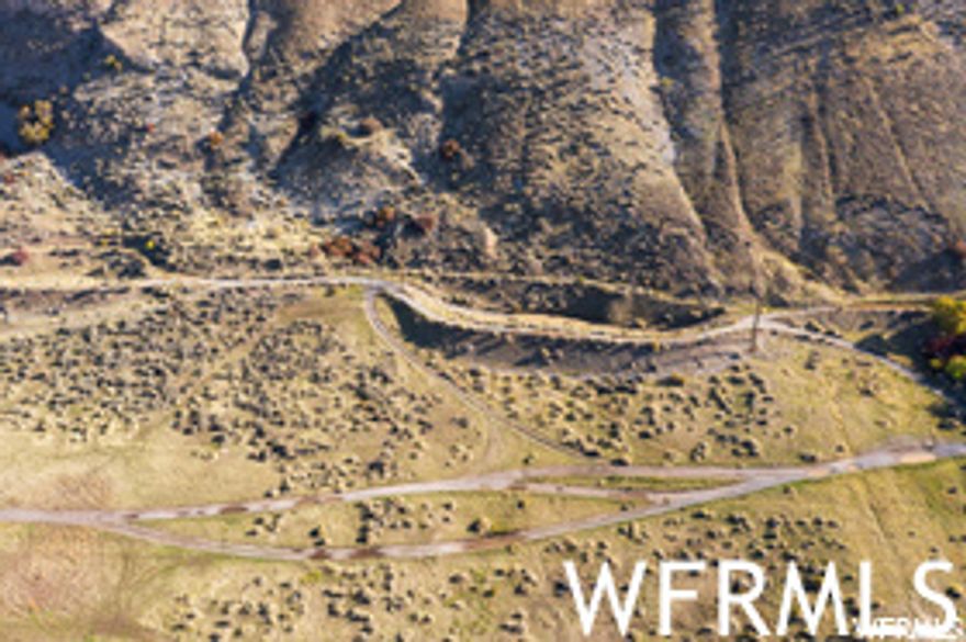 SPECTACULAR Pleasant Grove Bench Property located near Grove Creek and the G. Approx. 50 acres of prime land! 3 parcels sold together. Bring your plans for developing this amazing one of a kind property. Could possibly be 24 lots. Water available but NOT included.  figures are provided as a courtesy estimate only and were obtained from County records and plat legal descriptions. Buyer is advised to obtain an independent measurement of size and location. The following Tax IDs are included in the sale of this property: 14-037-0059, 14-037-0028, and 14-037-0075.