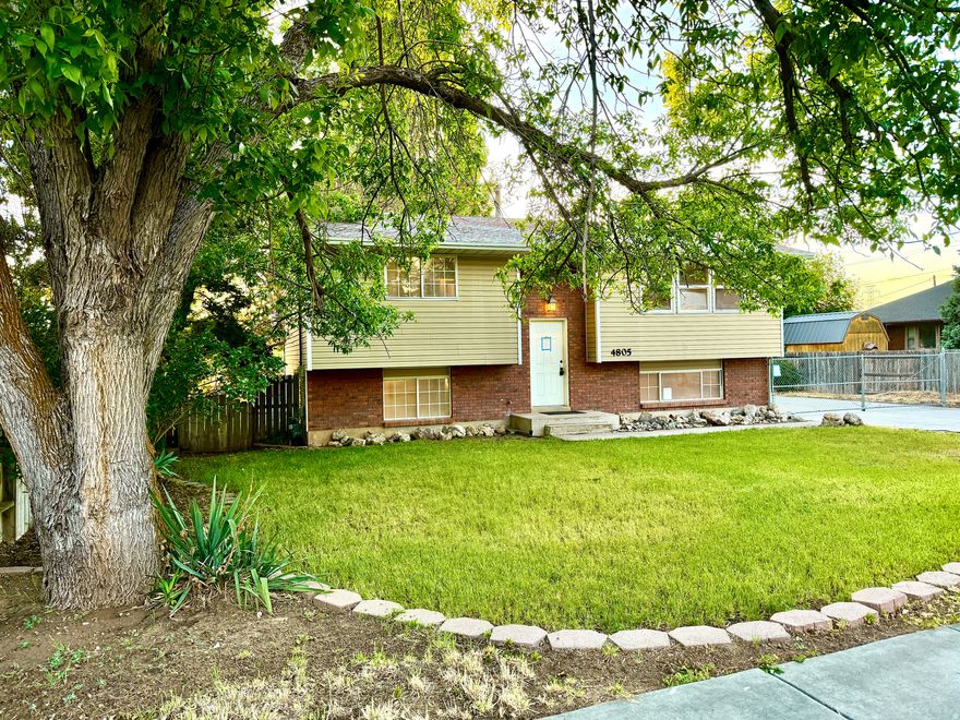 LUCKY YOU! Rare Opportunity to buy this 2,000+ square foot home with 4 bedrooms, 2 baths, a mostly finished basement, and ALL NEW CARPET! .Sitting on .23 acres, this lot lives LARGE, with a covered, solid wood deck just off the dining and kitchen area, the sunsets glow, and trees provide the perfect amount of shade. Upgraded kitchens are always a bonus - this one features oak cabinets, including customized corner appliance cabinets, a dishwasher, refrigerator, electric range & microwave. The basement mostly finished with 2 bedroom, a very special bath with a large jetted tub & a surprisingly big shower, family room, workshop, finished laundry room, and a basement entrance. The driveway is extra wide, extending to almost the end of the lot! The back portion being a poured floor and posts for a roomy 2-car garage - as it sits you can park at least six cars - a major upgrade. The yard is fenced with a driveway gate to complete the enclosed area. It's really a very great home at an even better price! **** PLEASE NOTE the basement finished room that would usually be used as a family room was used as 4th bedroom. As if all of this isn't enough... BRAND NEW CENTRAL AC was just installed!!  The natural 4th bedroom is 95% sheet-rocked, all power and venting is run, and the past occupants used this as a second workshop instead, it's filled with shelves & a 2nd workbench!  Updated Furnace w/ new AC should create an extraordinarily energy efficient home for you.  **Legal: This home was acquired through foreclosure, as such there is no property disclosure because the owner has no knowledge of the property. Information provided is deemed reliable, but not guaranteed. Buyer and buyer's agent to verify all information, including square footage, acreage, taxes, HOA information, and property condition, to their own satisfaction. Buyers & their agents should do all/any due diligence that is important to them. Square footage was taken from previous MLS listing.