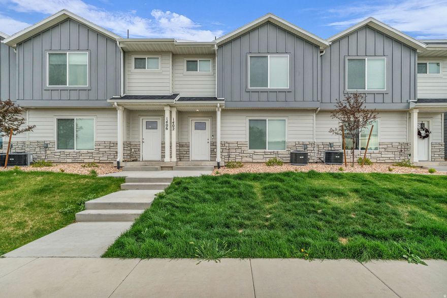 Welcome home to 1402 N Meadow Creek Lane, a stunning townhome where contemporary design meets the natural beauty of Spanish Fork. Built in 2025, this meticulously maintained 3-bedroom, 2.5-bathroom home offers over 1,500 square feet of bright, open-concept living space. Located in the coveted Meadow Creek community, you're just minutes from Costco, the new hospital, and I-15 access, making your commute a breeze while keeping outdoor adventure right in your backyard. Home also comes with an EV charger for electric vehicles. Don't miss your chance to own a piece of Utah County's most vibrant new neighborhood! Square footage figures are provided as a courtesy estimate only and were obtained from county records.  Buyer is advised to obtain an independent measurement.  Buyer/buyer's agent to verify all listing info.