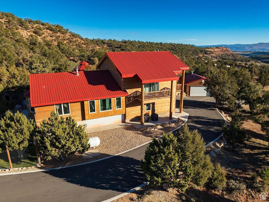 FRUITLAND!  BANDANNA RANCH!!  Very near the Landing Strip! Custom Cabins in the mountains with culinary water, power, septic system, phone line and maintained road for access! $250 yearly  HOA fee maintains the roads. This home is exquisite!  3 levels! The entire upstairs in the main cabin is master bedroom/master bath, walk-in closet, and includes a big bubble tub, lots of windows, and 3 balconies to view your forest! The main floor is open living room, kitchen, sitting rooms, a bathroom & has a room that could be a bedroom.  Actual hardwood floors and real stone countertops in this home fit right in with the natural environment! The property also has a guest/mother-in-law cabin. 588 sq feet on the main floor. 280 sq ft upstairs. 2609 Total sq ft for both! Both homes have kitchens, cast iron fireplaces, refrigerators, & stackable washers and dryers. The guest cabin has a kitchen, 2 bedrooms, a 3/4 bath, a family room, and an open deck upstairs for your astronomers! Outside-A beautiful water feature with waterfalls, a pond, and a bridge, with LED lights, all with a flip of a switch!  A second stream is natural and seasonal and can make a sledding hill in the winter with 2 bridges over a natural stream that is normally dry.  A bridge over the natural stream takes you to another part of the property.  Multiple outbuildings include a pavilion with LED lights by the stream. Colored lights in the stream. The guest cabin, a 2 car detached garage with workbenches and more! A nice grassy fenced front yard  accommodates outdoor dining and the pets.  Lots of room for friends and family to park their RV's.  Miles of backroad adventures!  Resident deer herds! Just an hour and a half from Salt Lake City!  Come see this to appreciate the beauty of the home and the area! Very near the landing strip if you have an airplane!  Please click on the photo for the drone pics!