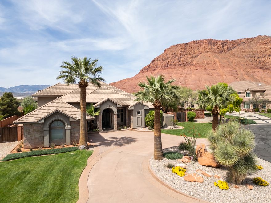 This property is a rare find. Located in the prestigious community of Citadel, in Ivins, Utah, and situated along a grand cul de sac.  An entertainer's dream home with an open floor plan on a well- appointed lush, .58 acre lot.   This home offers world-renowned, breath-taking views of Snow Canyon State Park, Red Mountain, and Chancel Cliffs, and is a short drive to scenic Pine Valley.  You really have to see this 4 bedroom, 3.5 bathroom, 3,495 sq ft home to believe it. Especially when it comes to the luxurious primary bedroom wing witha large walk in closet and spa like bathroom.   Enjoy entertaining in this large gourmet kitchen, where you can gather in a second dining area.  A third en suite bedroom has its own spacious living room, as well as a sweeping balcony where you can enjoy fabulous views of the red mountains as well as the twinkling city lights of Ivins, Santa Clara, and St. George.  An additional treasure is its proximity to nearby outdoor activities, including Tuacahn Amphitheater (walking distance), Hiking and biking trails, ATV Trails, and luxury golf courses.   You will find everything you could ever want in a custom home on a large, beautiful lot.