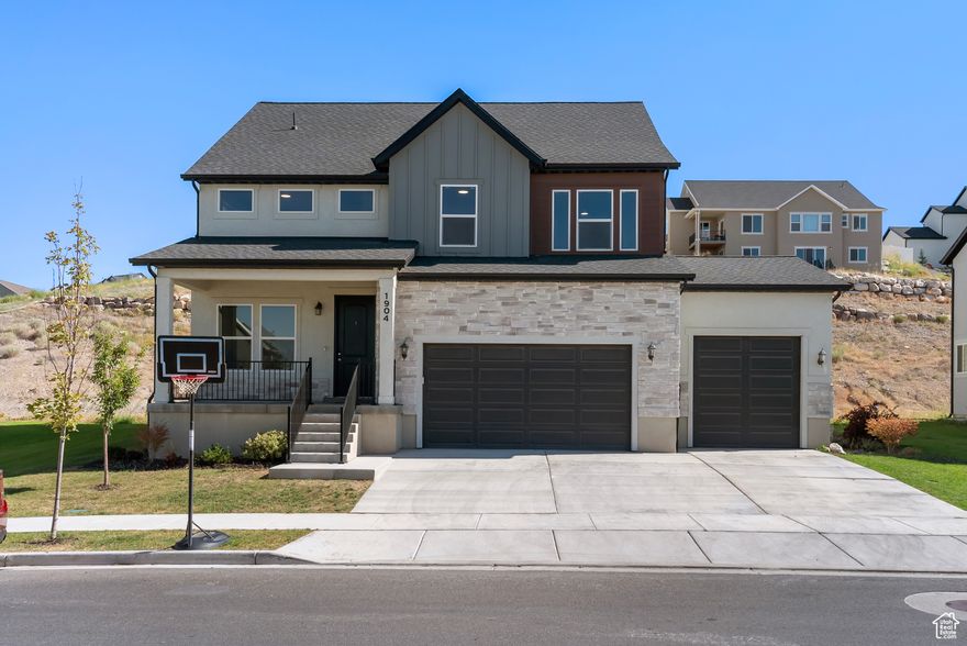 Nestled conveniently close to shopping and Pony Express Parkway, this stunning two-story home effortlessly combines luxury and functionality. Featuring 4 spacious bedrooms and 2.5 baths, the home is highlighted by vaulted ceilings and expansive windows that offer breathtaking mountain views. The front porch invites you to unwind and relax. LVP floors stretch throughout the main living areas. The gourmet kitchen is a chef's dream, complete with stainless steel appliances, custom cabinets, a stylish backsplash, an island, pendant lights and a large pantry. The master suite is a true retreat, boasting a large shower, walk-in closet, and plenty of space to unwind. Additional amenities include a versatile office/formal room, a mudroom, and an oversized 3.5-car garage with 12-foot ceilings and an insulated door. The 9-foot ceilings in the unfinished basement provide endless customization possibilities. Wired for Avative 2G fiber, this home seamlessly blends modern convenience with classic elegance on a generously sized lot. Beyond the home, the community offers pickleball courts, a picnic area, a pavilion, a playground, walking trails, and a dog park, ensuring a lifestyle of convenience and recreation. Don't miss the opportunity to make this extraordinary property your new home. Buyer to verify all.