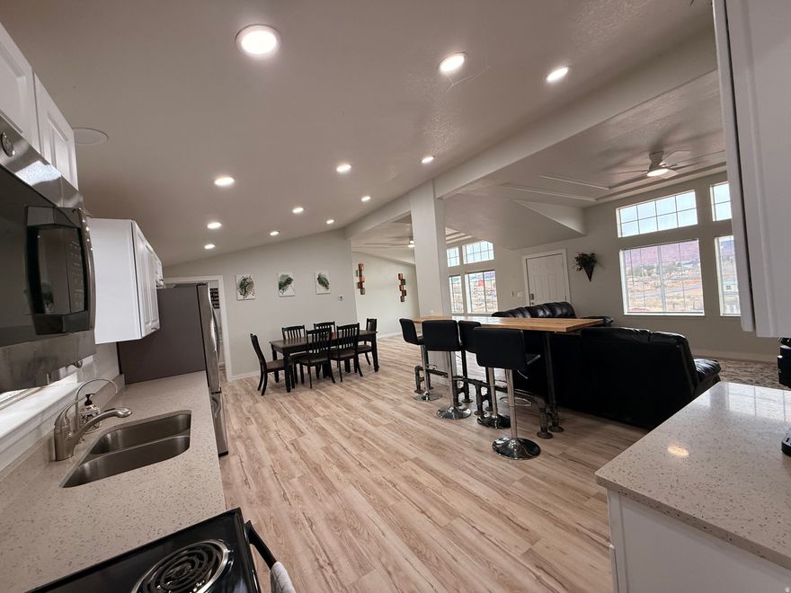 Come take a look at this one of a kind home with surrounding views of red rock! This home has been fully renovated, including: new roof, water heater, water softener, electrical service, water lines, heating and AC, fixtures and lighting, new septic tank system and SO much more! Bright and open floorplan. There is a separate ADU that is fully ADA accessible! The potential for a nightly or monthly rental in this tourist friendly town is great! Schedule a showing today! Square footage figures are provided as a courtesy estimate only and were obtained from county records. Buyer is advised to obtain an independent measurement.