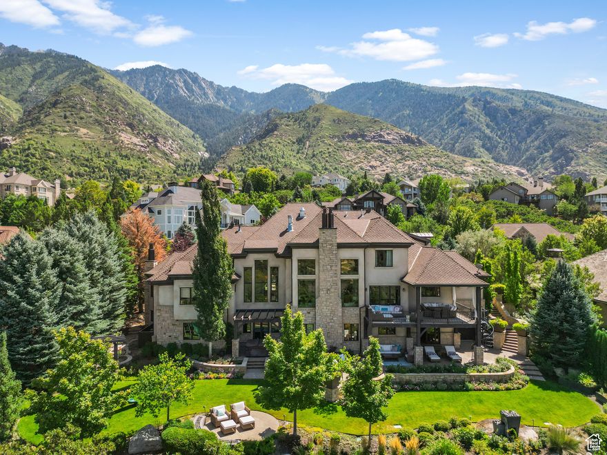 Retreat to your own safe haven located in the Exclusive 24 Hour Guard Gated 477 acre Pepperwood Community. Nestled at the base of the Wasatch Mountains, this stunning home offers breathtaking valley and mountain views Step Inside to discover the perfect blend of luxury & comfort. This spacious two-story entryway creates a welcoming atmosphere to large, open living areas with abundant natural light that showcase the home's expansive design. The main-floor primary bedroom suite includes a luxurious bathroom with dual fireplace, a Zen sitting area, a refrigerator, a breakfast bar, a steamer shower, and radiant heated floors. The heart of the home is a gourmet kitchen, complete with a large center island, perfect for both culinary endeavors and casual gatherings, top of the line stainless appliances and large walk in pantry. Then journey outside and enjoy spectacular Mountain & Valley Views & BBQ's with family & friends off the large covered deck and patio. The daylight/walkout lower level offers a separate entrance for apartment-style living with full kitchen, a game room, a home theater, a workout room, and a basketball court. A heated driveway leads to the oversized attached 5 car garage providing ample storage. Step outside and enjoy your private backyard with water features, a pond, multiple gathering areas, and open-flame fireplace. Discover an unparalleled lifestyle in the coveted 24 hr guard gated Pepperwood community,boasting an array of amenities including the pool with spa, large splash pad, lifeguards, competition swim team, sand volleyball, tennis, basketball and pickleball courts, playground/park, walking/biking trails, and Year-round Events that include 4th of July parade, Easter egg hunt, High school graduation party and food truck nights. The Pepperwood Community sets the stage for an active and vibrant lifestyle, fostering a strong sense of community. This Pepperwood Community is conveniently located within minutes of hiking and biking trails, world-class ski resorts, recreational activities, lakes, shopping, and the international airport.Don't miss out,Schedule your private tour today*Buyer to Verify all information and sq footage.Water Filtration System is excluded.