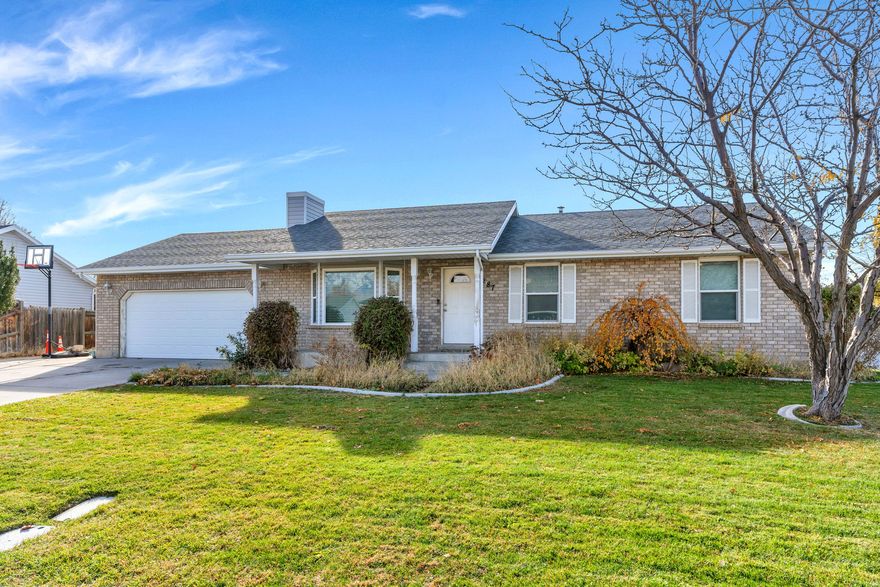 Charming rambler nestled in a quiet American Fork neighborhood! Ideally located less than five minutes from American Fork Junior High and Legacy Elementary School, and under ten minutes from I-15, shopping, and restaurants, this home offers both comfort and convenience. The kitchen features wood cabinetry, a breakfast bar with additional seating, and a dishwasher. Natural light fills the inviting living area, creating a bright and welcoming atmosphere. The primary bedroom includes an ensuite bathroom for added privacy. Downstairs, you'll find a spacious family room, office, two bedrooms, a bathroom with a walk-in shower, and ample storage. The fully fenced backyard is perfect for entertaining or relaxing outdoors. Complete with a two-car garage and RV parking, this home truly has it all! Measurements provided as a courtesy only, buyer to verify all info.