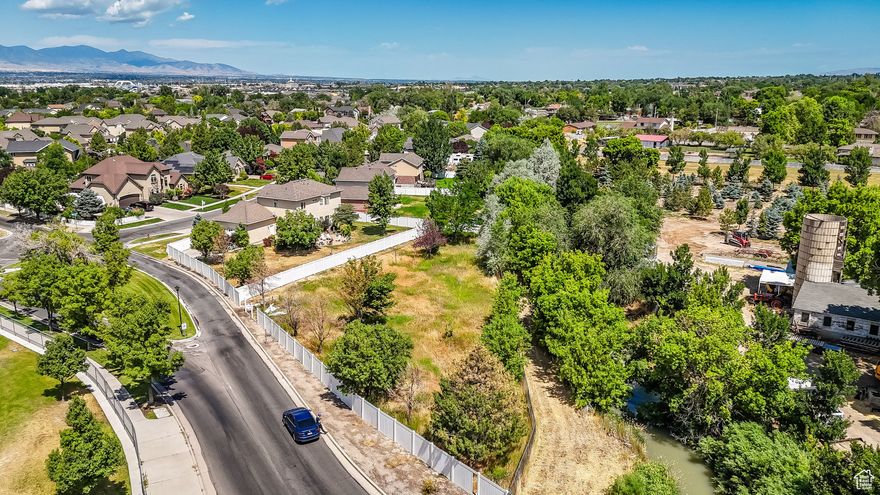 Build your dream home in one of Draper's most desirable neighborhoods! This rare 0.35-acre lot is flat, partially fenced, and perfectly positioned across from Corner Canyon High School. Tucked in a quiet residential area with mature trees and a canal behind the property, this lot offers privacy and prestige with no HOA. Enjoy stunning views of the Wasatch Mountains and easy access to trails, parks, and local amenities. Zoned R-3 for a custom single-family home. Utilities are nearby (buyer to verify). Bring your own builder and vision-opportunities like this are nearly gone in Draper. Don't miss your chance to secure this prime location in the Whisperwood subdivision.