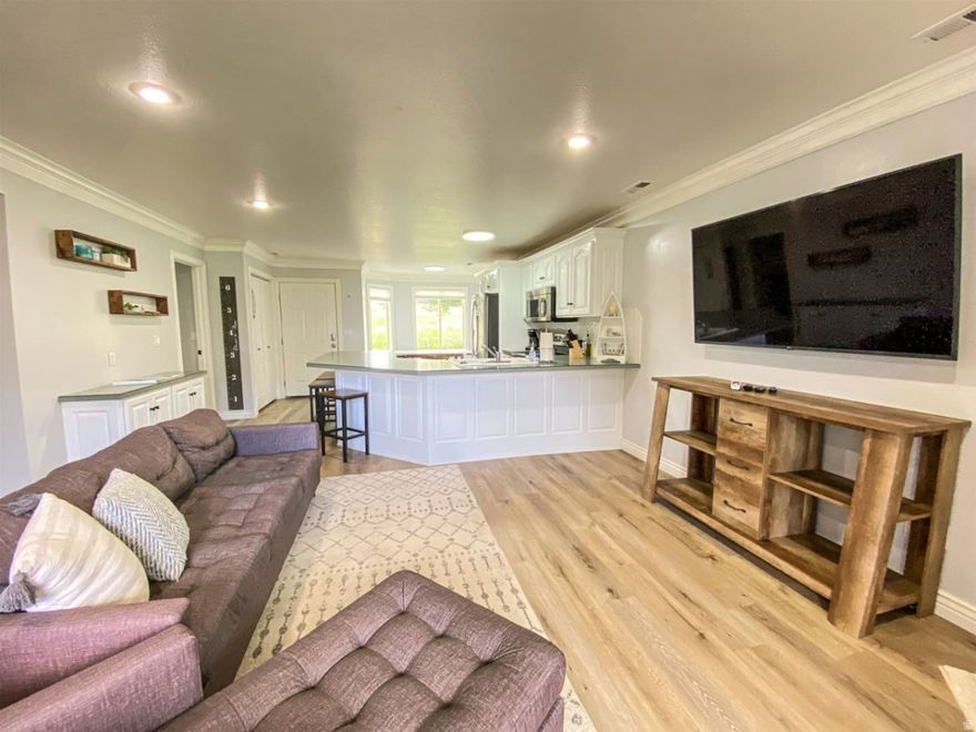 This unit is a GEM! Remodeled in 2020, fully furnished and ready to go from day 1. Amazing lake views of the marina and the surrounding mountains. You are only steps from the community pool, spa, trails, marina, and big grass area to hang out and play. Current owners have made this into a perfect short term rental or an owners get away. Plenty of space to have a big family hanging out and still be comfortable. Right in the heart of Garden City and close to all of the action. Buy now for a summer of fun or to do short term rental. It is being used as a short term rental already with 5-star rating and Super Host status with all the systems and processes in place.