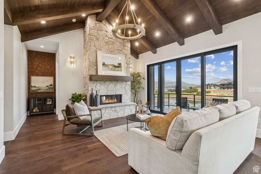 Up to 20% seller financing available - ask for details! . Crafted for those who seek both luxury and adventure, here you will find elevated living above the Jordanelle with a front-row seat to Park City's mountain skyline. This new home delivers more than just refined elegance -it's a basecamp for the good life. Featured in the 2024 PC Showcase of Homes, every element speaks to thoughtful design. The home reveals a mix of craftsmanship and comfort: wide-plank engineered wood floors anchor the living spaces, a chef's kitchen blends custom cabinetry with professional-grade appliances, and expansive windows frame the mountain backdrop like fine art. The great room's stone fireplace and gorgeous wood paneled vaulted ceiling pull the gathering space together, while the primary suite is its own retreat, complete with fireplace, spa bath finishes and radiant heat floor. Downstairs, entertainment takes center stage with a walk-out family room, wet bar, media room and custom finished guest suites designed to welcome friends without ever feeling crowded. Multiple decks and patios invite you outside for coffee at sunrise, colorful sunsets and stargazing over the lake at night. A 4-zone heating and cooling system,  tankless water heater and heated garage offer maximum comfort and upgraded spray foam insulation provides an airtight home. This home also balances privacy with proximity. From the front door, it's minutes to Deer Valley's new East Village for fresh tracks and new trails, and a short drive to Park City Mountain's endless terrain, shopping and dining. Tee time is out the back door as Hideout's executive course winds through the community and the home is on the 2nd hole.  Vast recreational opportunities in the Uintas or on the Jordanelle are just down the road. When adventure calls farther out, Salt Lake Airport is less than 45 minutes away. Where the lake meets the mountains, life finds Its balance.