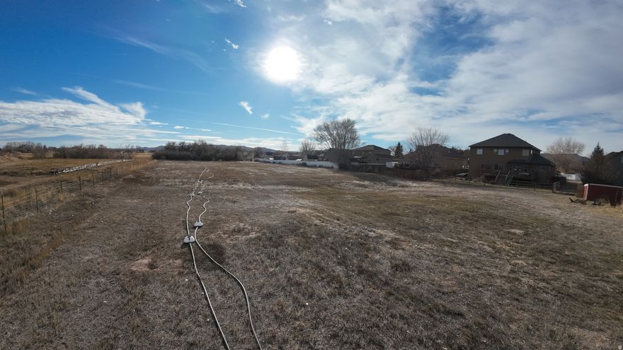 Great 4.18 acres located in Vernal City.  Utilities in street,  well on property, live water and 2 water shares.  Electricity to well is hooked up to owners residence.  Buyer and Seller will have to agree as to what can be done with that.  You must see this plot of land - shipping container and greenhouse on land are excluded and barn remains with sale. Buyer to verify all information.