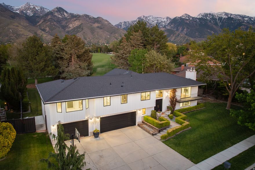 Perfectly positioned just behind the 6th tee box of Willow Creek Country Club, this exceptional residence captures panoramic fairway and mountain views through a dramatic vaulted ceiling and stunning windows that fills the home with natural light. Completely remodeled in 2015/2016 with intention and style, every finish has been thoughtfully curated to deliver a clean, modern aesthetic balanced by a warm, welcoming feel. The redesigned kitchen features a substantial quartzite island, matching countertops, and striking custom lighting-creating a space that is as functional as it is visually impressive. Open-concept living areas flow effortlessly to an expansive deck of nearly 400 square feet, perfectly positioned to overlook the lush greens-ideal for entertaining or unwinding in a serene, scenic setting. Offering five bedrooms and four bathrooms each with updated tile, lighting and sinks and faucets.  The layout is both spacious and versatile and a new place to call home. A three-car garage provides ample storage, while the .29-acre lot is surrounded by mature landscaping that enhances both privacy and curb appeal. Freshly painted and meticulously maintained, this home presents a rare opportunity to experience elevated golf course living in one of the area's most picturesque settings.