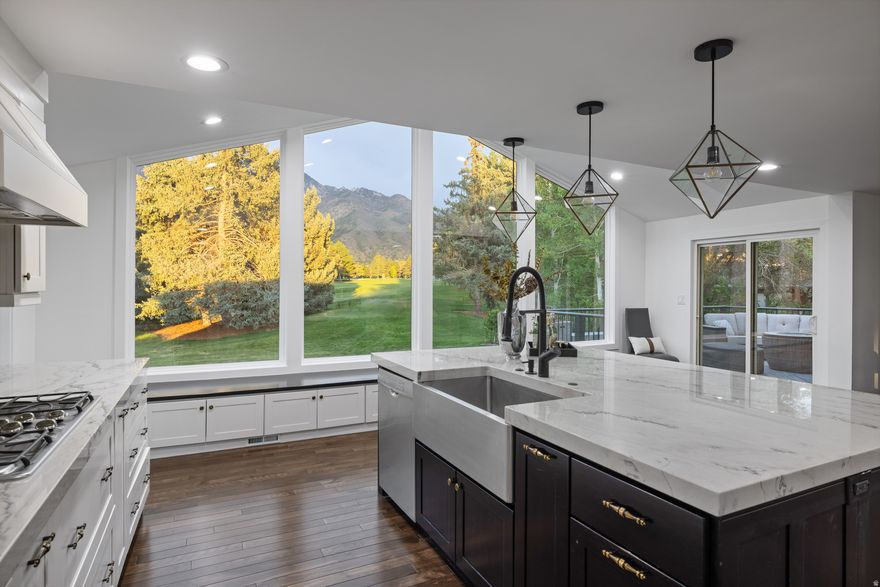 Perfectly positioned just behind the 6th tee box of Willow Creek Country Club, this exceptional residence captures panoramic fairway and mountain views through a dramatic vaulted ceiling and stunning windows that fills the home with natural light. Completely remodeled in 2015/2016 with intention and style, every finish has been thoughtfully curated to deliver a clean, modern aesthetic balanced by a warm, welcoming feel. The redesigned kitchen features a substantial quartzite island, matching countertops, and striking custom lighting-creating a space that is as functional as it is visually impressive. Open-concept living areas flow effortlessly to an expansive deck of nearly 400 square feet, perfectly positioned to overlook the lush greens-ideal for entertaining or unwinding in a serene, scenic setting. Offering five bedrooms and four bathrooms each with updated tile, lighting and sinks and faucets.  The layout is both spacious and versatile and a new place to call home. A three-car garage provides ample storage, while the .29-acre lot is surrounded by mature landscaping that enhances both privacy and curb appeal. Freshly painted and meticulously maintained, this home presents a rare opportunity to experience elevated golf course living in one of the area's most picturesque settings.