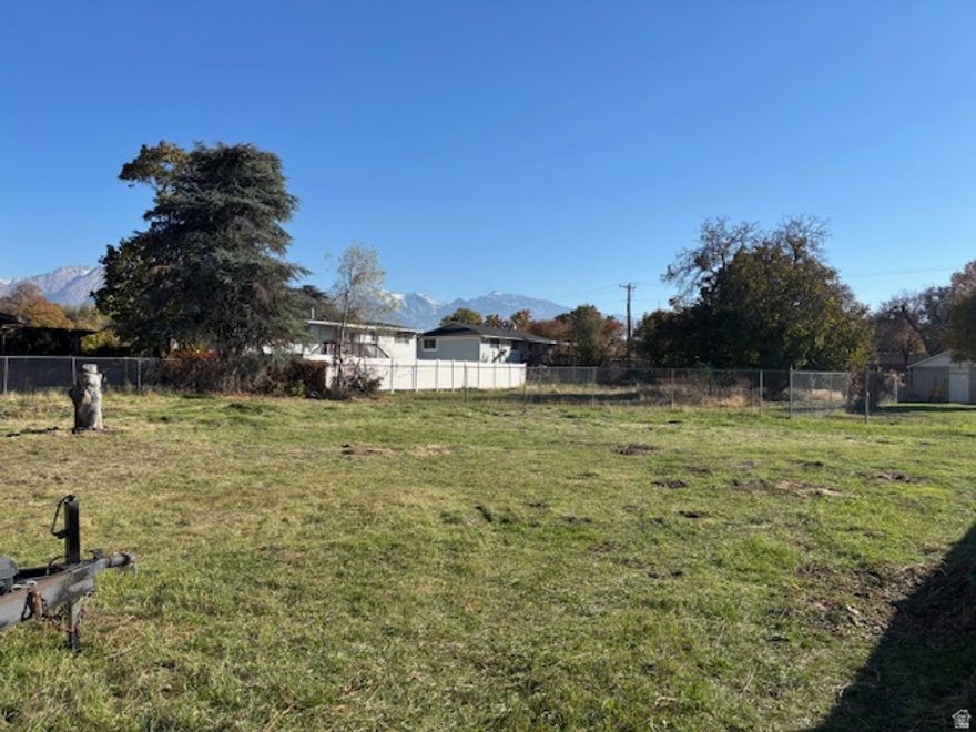 Quiet East Murray neighborhood. Level flag lot in a wonderful location. Mountain View to the east. 28 foot wide driveway easement access. There may be a possibility  of purchasing irrigation water. Listing agent has information for possible home to be built.