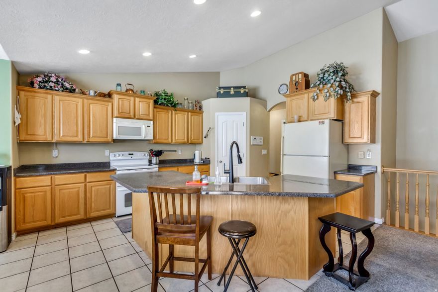 OPEN HOUSE SAT 12- 2 PM. SELLER FINANCING. RARE BONES. OUTSMART THE MARKET. OWN THIS FOREVER HOME - NOW REPOSITIONED $65,000 BELOW PREVIOUS LISTING.  CLAIM a Million-Dollar 5-Car Deep Garage. Plus RV & Toys parking. UPSIZED 3-Bedroom ADU to HOUSEHACK mortgage payment. Not the Typical 1-Bedroom Setup. **SHIELD Your Family from Rising Utility Costs with $50K in Solar Panels That Have Produced Electric Bills as Low as $10 Per Month.*"  *Per seller-reported history.  Most buyers chase finishes.  Smart buyers secure ADU income and almost zero utilities. Needs TLC. This is not an entry-level compromise. This is a high-capacity Forever Home engineered for families who think HOUSEHACKING.  Let's connect the dots.  THE GARAGE MOST $1M HOMES DON'T EVEN OFFER  Five-car tandem capacity. 10' ceilings. RV-sized door. Dedicated RV pad. Extended driveway parking. No HOA restrictions.  Bring the RV. Bring the boats. Bring the trailers. Bring the toys.  Stop paying storage facilities. Stop asking for permission. Stop compromising on space.  This is garage capacity that even many million-dollar homes cannot compete with.  THE UPSIZED ADU - NOT THE TYPICAL 1-BEDROOM BASEMENT  This is a full 3-bedroom lower level with private entrance, kitchenette, full bath, and separation.  Not a cramped one-bedroom setup.  Not an afterthought.  A layout built for:   Income flexibility  Multigenerational living  Teen independence  Guest quarters  Long-term adaptability  Most homes give you square footage.  This one gives you options.  $50,000 IN SOLAR - BUILT TO SHIELD, NOT GAMBLE  50 solar panels. Heat pump integrated system. Designed to offset rising utility volatility.  In a time where costs keep climbing...  This system has produced electric bills as low as $10 per month.*  That's not hype. That's documented seller history.*  You can't control inflation. You can't control rate hikes. But you can control how exposed you are.  This home was built to reduce that exposure.  FOREVER HOME SCALE  6 bedrooms. 3,366 square feet. 0.29 acre corner lot. Walkout basement. Vaulted ceilings. Family rooms upstairs and down. Office/den flexibility. Mature landscaping. Garden beds. Fruit trees. Fully fenced yard.  This is not a temporary house.  This is a long-game property.  THE SWEAT EQUITY ADVANTAGE  Let's address it directly.  Yes - there is room for paint and carpet refresh.  And that is precisely where the opportunity lives.  While others overpay for someone else's cosmetic taste...  You secure structural advantages first.  Simple cosmetic updates unlock instant equity potential.  That is not a drawback.  That is leverage.  THE REPOSITIONING ADVANTAGE  Now $65,000 below the previous listing.  Not because something is wrong.  But because the strategy changed.  And smart buyers move when opportunity and structure align.  This is that alignment.  Homes like this don't get discounted. They get recognized.  The only question is whether you recognize it before someone else does.  Schedule the showing. Walk the garage. Stand in the lower level. Run the numbers.  Then decide.  But decide with facts - not hesitation. Seller financing may be available for qualified buyers.
