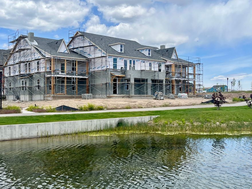 BRAND-NEW Luxury Townhome in a COVETED WATERFRONT Location!  Situated on Daybreak's newest attraction, The Watercourse, this stunning townhome offers unparalleled access to Lookout Park and The Cove-house. The expansive open floor plan showcases a gourmet kitchen with a spacious island. Go upstairs to find a cozy loft, 3 bedrooms, and a dedicated laundry room. The primary suite features a separate tub and shower, double vanity, walk-in closet, and a private balcony with breathtaking views. With direct water access, you can easily launch your paddle-board and embrace the peaceful waterfront lifestyle. Daybreak amenities include: Pools, Gym, Parks, Trails, Downtown Daybreak, Bees Stadium, Trax, Restaurants & More! Buyer and buyers agent to verify all information. Interior photos of a similar unit. Colors and selections may vary.