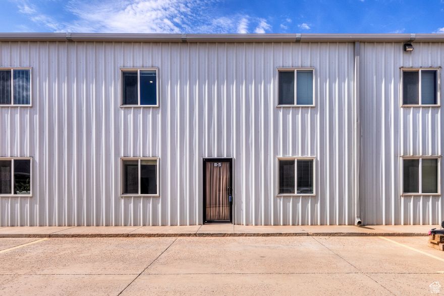 Unlock the perfect blend of work and comfort in this unique Moab Business Park space! This unit offers flexible commercial space ideal for office, workshop, or storage use, plus private living quarters for added convenience. Spacious work area-perfect for small business operations. Comfortable living space includes bedroom, living room, bathroom, and kitchen area. Prime location with easy access to downtown Moab, Highway 191, and local services. Ample parking with room for vehicles and equipment. Whether you're an entrepreneur, investor, or seeking a live/work setup in Moab, this property offers an unbeatable combination of functionality and lifestyle. Don't miss this rare opportunity! Contact us today for details and a private showing. The warehouse space is 45x25. All kitchen appliances are new. Washer/dryer included. Lock-out closet in warehouse with storage above.