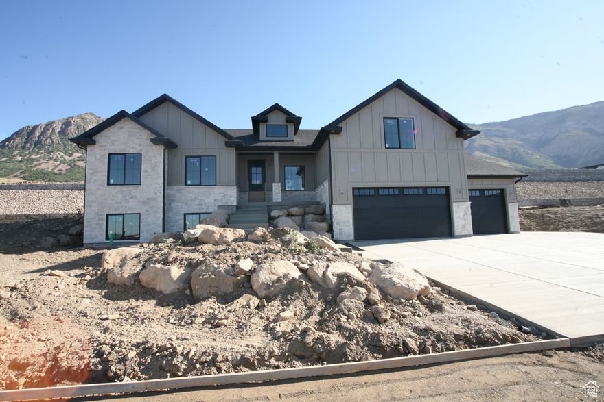 Brand New Home surrounded by mountains and valley views.  All the features of a custom home are included in this home. The grand entry, gourmet kitchen, with gorgeous custom cabinets and quartz countertops and stunning backsplash make this kitchen a dream, for those that love to cook you will love the upgraded appliances, Wall ovens, gas cooktop, chef grade hood and fridge is included. Don't forget the storage with walk in pantry. The nice great room, with vaulted ceiling, stone fireplace and wall of windows make this area so spacious. The open stairwell and entry makes this home say welcome. The bonus space off the main level is so nice could be used for so many things, and the views are amazing.  The Master suite getaway gives you a spa feel with freestanding tub, double wide shower, with double sink vanity and walk in closet gives you the space you need to relax. Closets and storage areas are well planned. The structural details you will enjoy with 9 foot basement ceilings, 9 foot and 11 foot main level ceilings and grand vaults. The home a nice 3 car garage with nice height, and a wonderful RV Pad. The basement space has 2 additional bathroom, 3 bedrooms, Laundry, Kitchen with full appliances. Home estimated to be finished in September Home is in final stages.  Feel free to call about new homes in North Ogden and Pleasant View coming soon. Prices Ranging from $889,000 to $1.350,000 in schedule a personal showing.