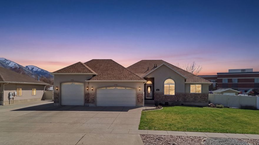 Welcome to this stunning custom home in the highly sought-after Nibley Gardens neighborhood, where thoughtful design, high-end upgrades, and everyday comfort come together beautifully. From the moment you arrive, you'll notice the exceptional attention to detail and features that truly set this home apart. This beautiful home is loaded with extras, including radiant heating throughout all floors (even the garage), a built-in humidifier, a radon mitigation system, solar panels, and a whole-home stereo system you can enjoy throughout the entire house. The kitchen is a standout with quartz countertops, double ovens, and beautifully crafted cabinetry, perfect for both daily living and entertaining. Inside, you'll love the gorgeous hardwood flooring, vaulted ceilings, a cozy stone fireplace, a spacious laundry room, and a remodeled primary bathroom featuring a large, luxurious shower. Outside is just as impressive with a fully landscaped yard, a covered patio, and a built-in firepit, creating the perfect space to relax or host gatherings. The property also offers a 16x18 shed, an oversized (15x31) air-conditioned third garage bay, and a large RV pad, giving you all the space you need for vehicles, toys, and more. This is one you truly need to see in person! Square footage figures are provided as a courtesy estimate only and were obtained from an appraisal. Buyer to verify all information.