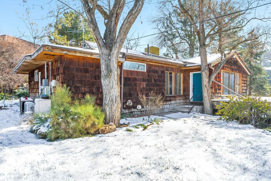 Home with Completely Separate Guest House in Prime Cottonwood Heights Location.  Primary residence 2,566 sq ft has 3 bedrooms - 2 bathrooms with 2-car garage. Lovingly maintained and thoughtfully upgraded, this spacious home offers comfort, style, and functionality, featuring fully remodeled bathrooms, a modern kitchen with concrete countertops, and a private master suite with a walk-in closet, walk-out patio, and peaceful pond with waterfall. The home includes an efficient HVAC system installed six years ago, a tankless water heater for endless hot water, and a split mini system for zoned air conditioning. Outside, enjoy a backyard patio ideal for entertaining along with an advanced 8-zone sprinkler system with drip irrigation for easy, efficient landscaping.   Guest house 1360  sq ft has 2 bedrooms - 1 bathroom and a 2-car garage with private driveway (details noted as "Level 2").  This true stand-alone guest house offers complete independence and privacy with its own driveway, private entrance, fenced yard, and garage-making it ideal for visiting family, multigenerational living, or long-term rental income. Inside, you'll find sleek quartz countertops, beautiful hardwood flooring throughout, modern stainless-steel appliances, and an energy-efficient tankless water heater for comfort and efficiency.  Minutes from Big & Little Cottonwood Canyons! An exceptional opportunity to own a home with a fully independent guest house in the heart of Cottonwood Heights-perfectly situated within walking distance of the Cottonwood Recreation Center, top-rated schools, and just a short drive to world-class skiing, hiking, and outdoor adventure.