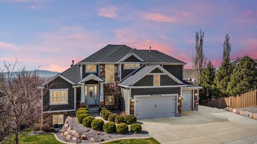 Perfectly positioned on the coveted Farmington East Bench! This custom two-story offers main-level living with breathtaking mountain & lake views. Close to scenic hiking trails, a neighborhood park, with the shopping, dining, & entertainment of Station Park close by. Designed with entertaining in mind, this home features a spacious open-concept great room & kitchen with upgraded trim throughout, soft-close cabinetry, a custom range hood, farmhouse sink, & built-in dining bench seating. Multiple exits lead to the large deck, creating seamless indoor-outdoor living perfect to take in the views. The vaulted primary suite on the main level offers a luxurious retreat with a spa-style bathroom featuring a soaker tub, walk-in shower, separate vanities, & a large walk-in closet. Upstairs you'll find three additional bedrooms & a versatile loft/office space, including a bedroom currently designed as a playroom complete with a custom built playhouse. The fully finished basement is built for fun & gathering with laminate flooring, a large wet bar, & an open-concept theater room with stage seating. Kids will love the slide & playroom tucked under the stairs. Additional highlights include a custom safe/vault room, large guest bedroom with walk-in closet, hidden storage room, & walkout access to a covered patio. Outside, enjoy mature landscaping with drip irrigation, RV parking, and a 4 car epoxy-coated garage with built-in storage & workbench.