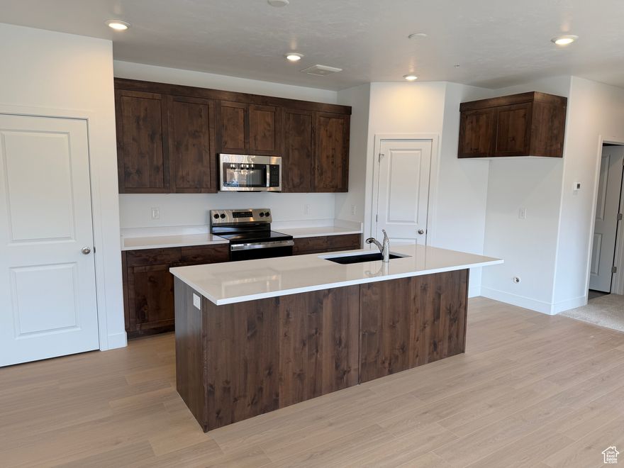 Beautiful move-in ready condo available now at River Run in Spanish Fork! This beautifully finished home features tall 9-foot ceilings, upgraded quartz countertops, a tankless hot water heater, and large windows with blinds already installed. Enjoy resort-style amenities including a pool, clubhouse, and pickleball courts, all in a prime location near the Spanish Fork Rec Center, great freeway access, and close proximity to everything you could need. Move in ready homes in this community don't come up often. Schedule a tour today and see the Keystone Construction difference!