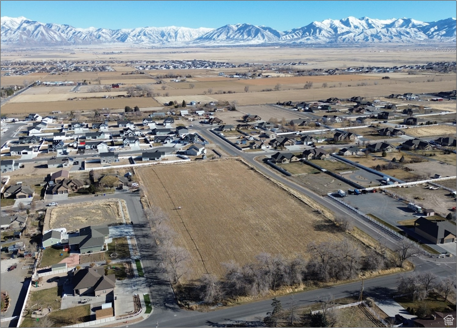 5.38 acres located on the NE corner of 500 S and Hale Street, Grantsville City, Tooele County, Utah. Zoned R-1-21 in Grantsville City west of Grantsville Estates. Water: 10-inch line in Hale Street, 8-inch line in 500 South. Sewer: 8-inch line in Hale Street and Cranberry Street. Power: Rocky Mountain Power. Gas: Enbridge Gas. Tooele County parcel 01-073-0-0027, 2024 Taxes: $27.61. 8 miles to Tooele, Utah. 30 miles to Salt Lake City, Utah.