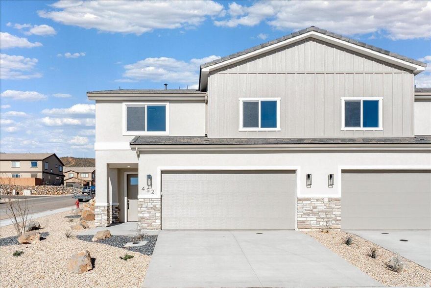 Welcome to this brand-new 4-bedroom, 2.5-bath townhome in the heart of Hurricane, Utah, offering 2,346 sq ft of beautifully designed living space. Thoughtfully upgraded throughout, this home features granite countertops, engineered wood flooring, and tile showers and baths that bring both style and durability together. The open-concept layout is perfect for entertaining or everyday living, while the large bedrooms provide comfort and flexibility for family, guests, or a home office. Enjoy the convenience of a full-size 2-car garage and low-maintenance living with HOA dues of just $100 per month. Ideally located near outdoor adventure, you're just minutes from world-class hiking, biking, and sightseeing at Zion National Park, with easy access to local shopping, dining, and schools.  Whether you're looking for a primary residence, second home, or investment property, this move-in-ready townhome delivers modern finishes, generous space, and an unbeatable Southern Utah lifestyle.