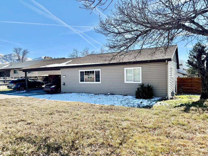 Updated Rambler style home with large lot! This corner lot home features mature trees, updated kitchen, two carport, large backyard and newer flooring.  Close to UVU and BYU.  Great rental property! Buyer and Buyers agent to verify all. Figures provided are an estimate only.